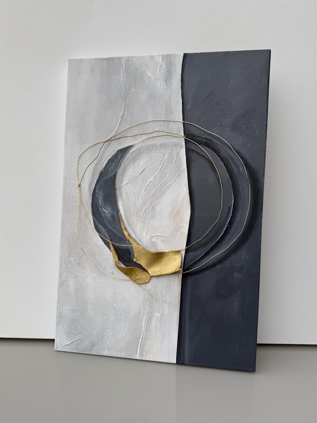 círculo, Made to order, any size — A canvas split into black and white, with a gold circle holding the two halves together.