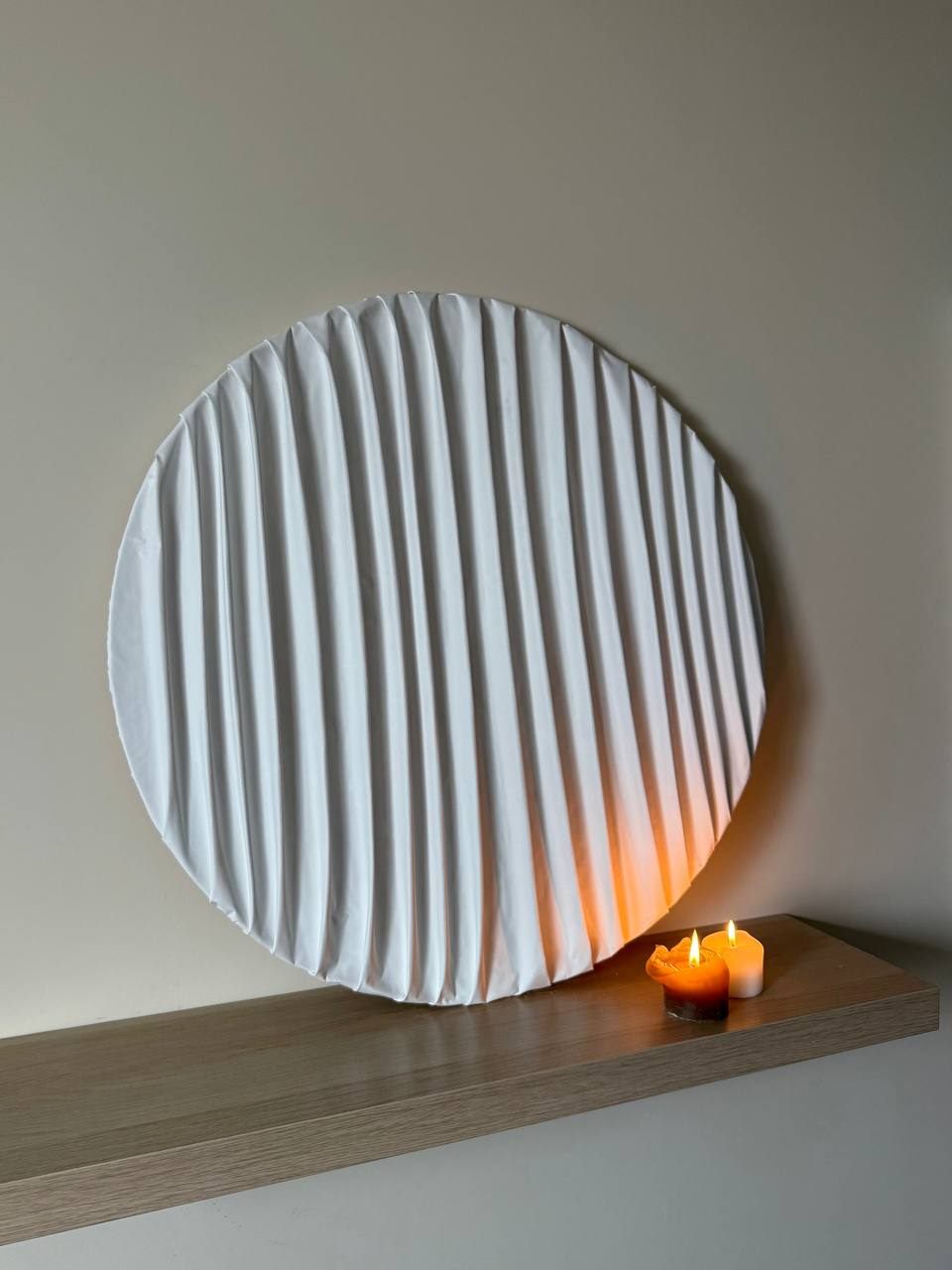 cuerdas, Ø80 cm — A round sculpture in coated fabric on a wooden base.