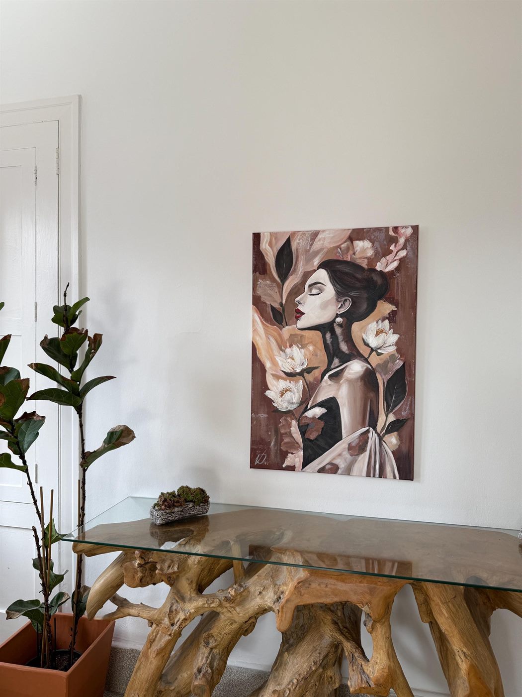 mirada, 60×80 cm — A woman in profile among magnolias, warm terracotta and rose over a dark ground.